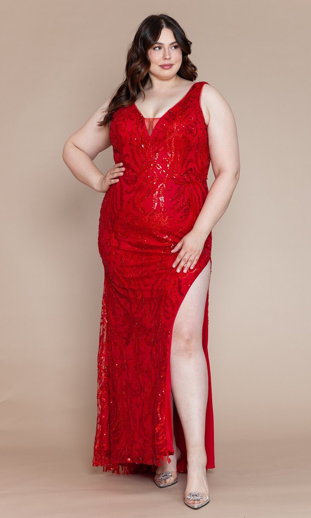 A woman wears the Glitter-Print Long Plus-Size Prom Dress W1140 in red, featuring a sleeveless design, deep neckline, thigh-high slit, and floor-length fit, standing against a plain background.